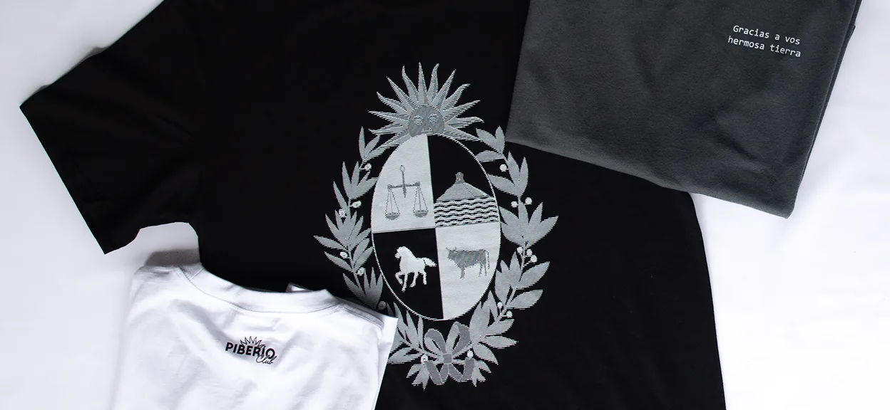 The national crest printed across the garments the store sells