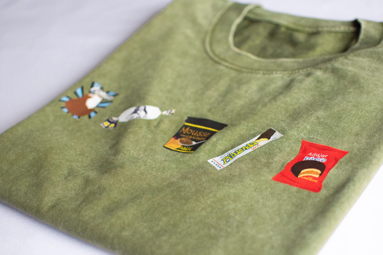 Piberio green shirt detail with embroidered Uruguayan sweets graphics